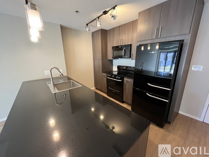 A white toilet sits next to a bathtub in a bathroom.