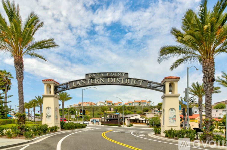 A street view of a sign that says Lantern District.