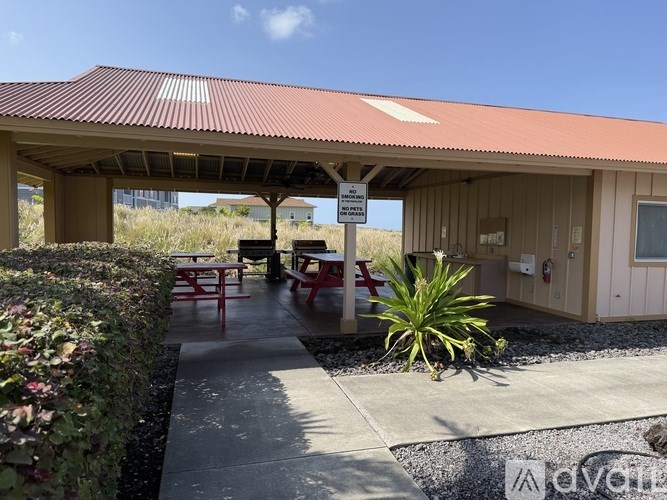 A covered picnic area with tables and chairs is shown.