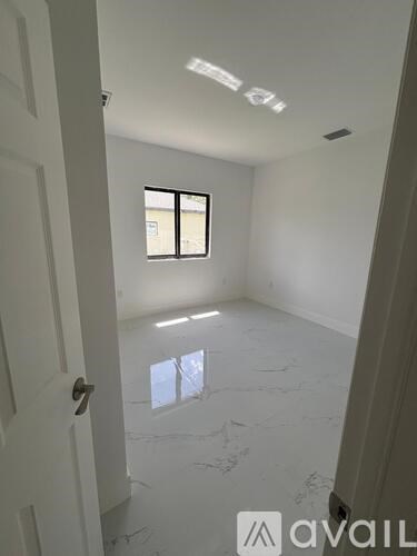 A room with a door and a window.