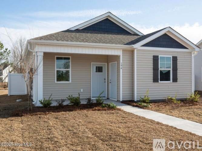 A small house with a white door and a small window is shown.