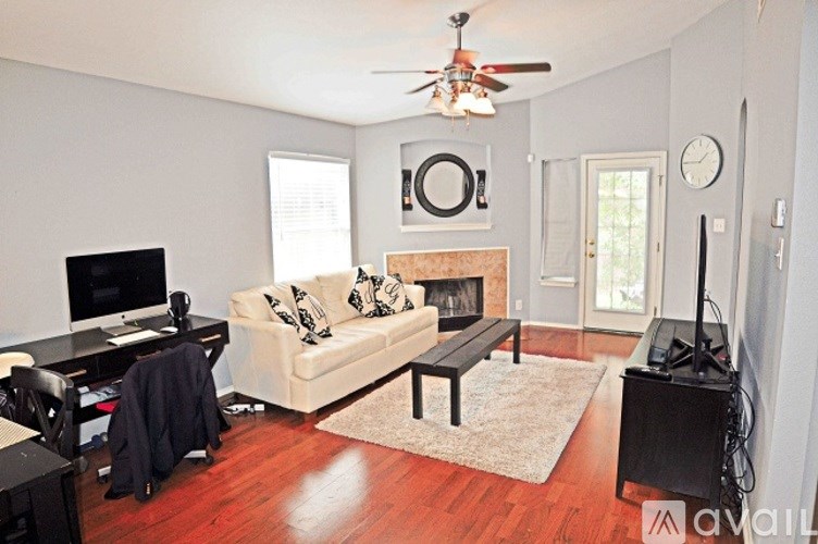A living room with a fireplace and a couch.