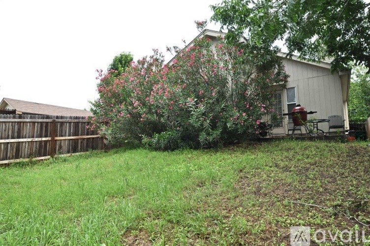 A house with a red fire hydrant in front of it.