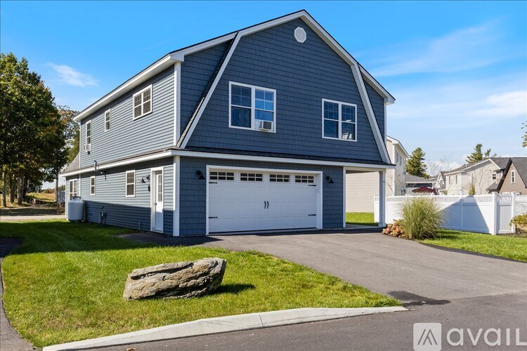 A house with a garage is available for sale.