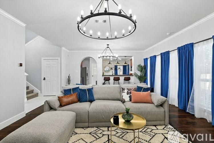 A kitchen with dark blue cabinets and a white countertop.
