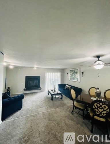 A living room with a fireplace and a sofa.