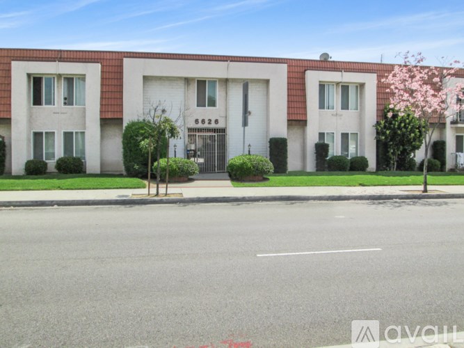 A street view of a building with the number 6626 on it.