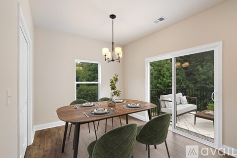 A dining room with a round table set for four.