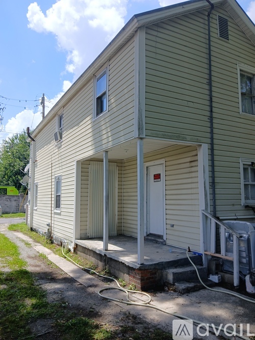 A house with a white door and a porch.