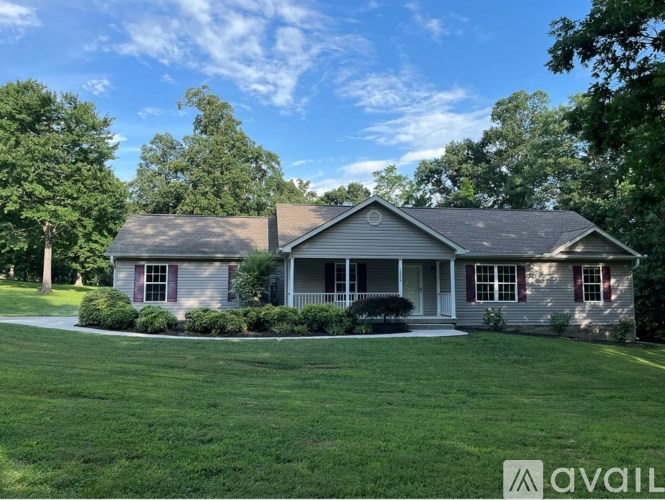 A house with a lawn in front of it is for sale.