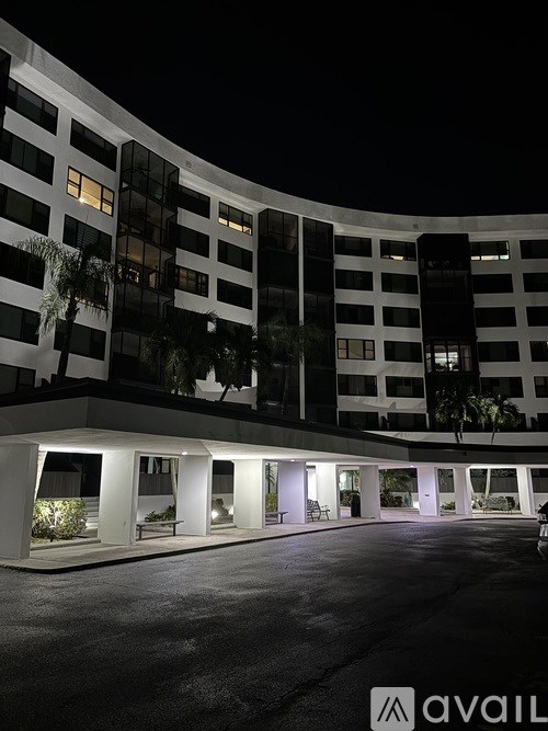 A balcony with a view of a city and a body of water.