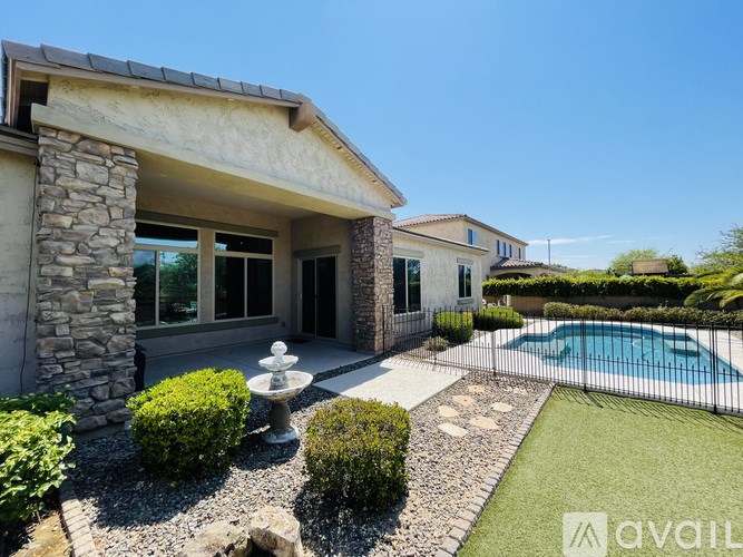 A house with a pool in the backyard.