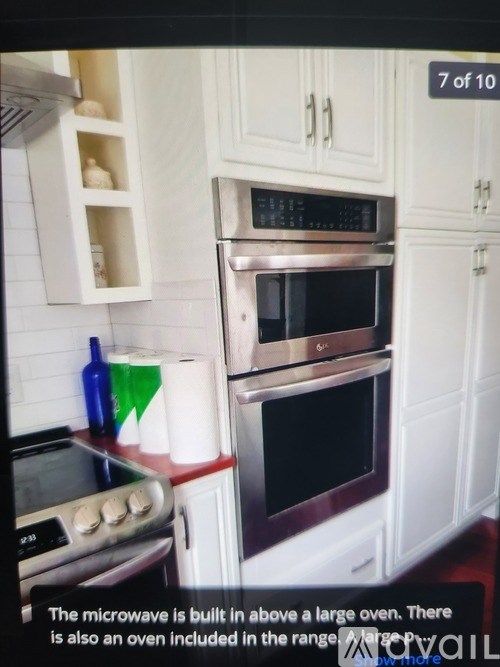 A kitchen with a microwave above a stove and an oven built into the cabinetry.