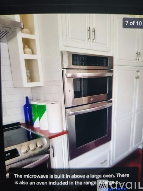 A kitchen with a microwave above a stove and an oven built into the cabinetry.
