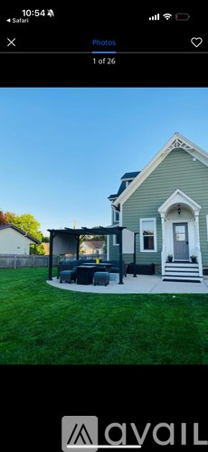 A house with a green lawn and a white door.