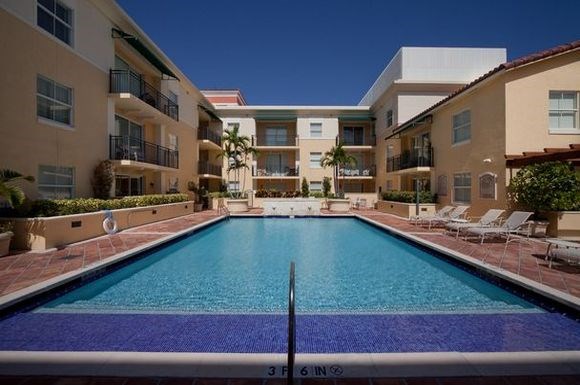 a swimming pool in the middle of an apartment building