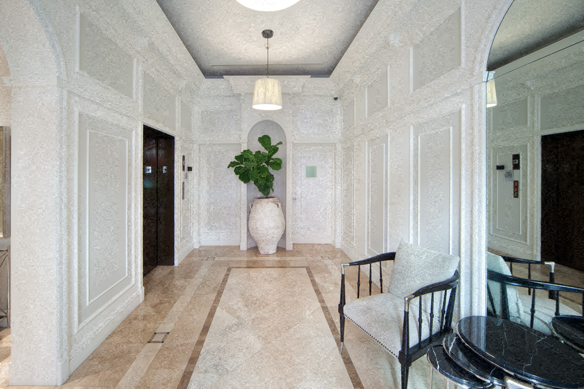 a dining room with a table and chairs and a large vase