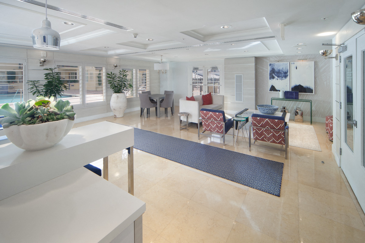 a large living room with a dining room table and chairs