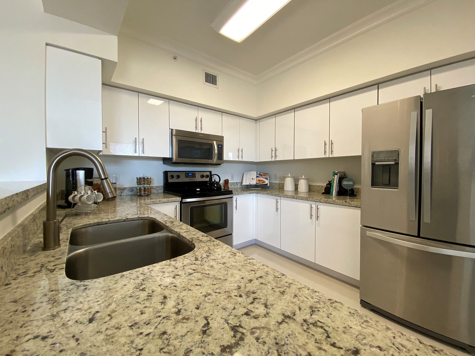 a kitchen with stainless steel appliances and granite counter tops