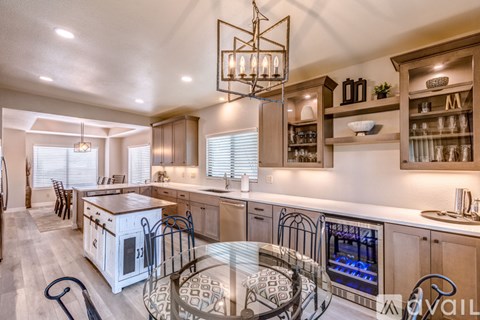 A kitchen with a white oven and a glass table.