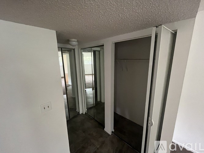 A room with a white ceiling and a white door.