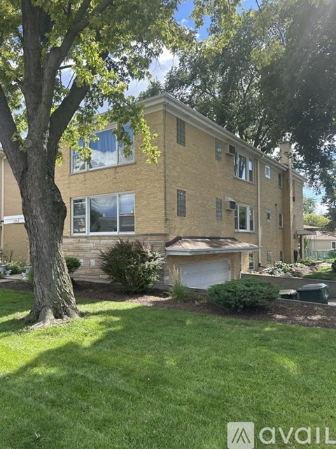 A house with a tree in front of it.