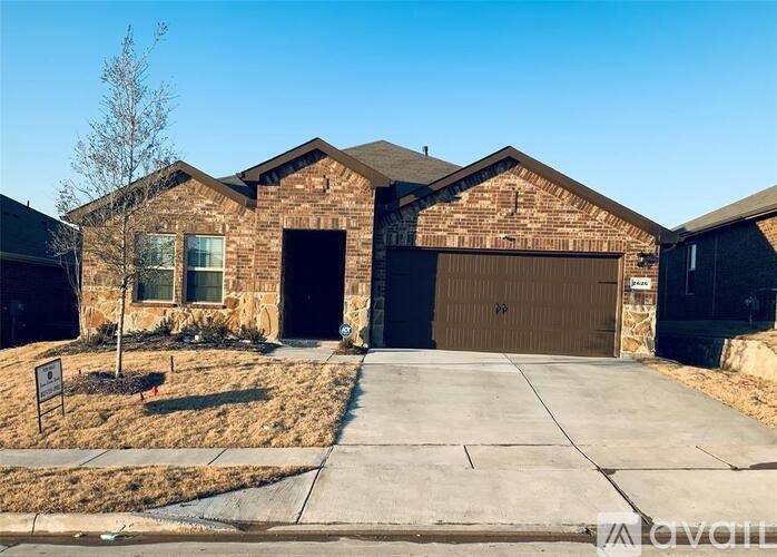 A house with a brown garage door is for sale.