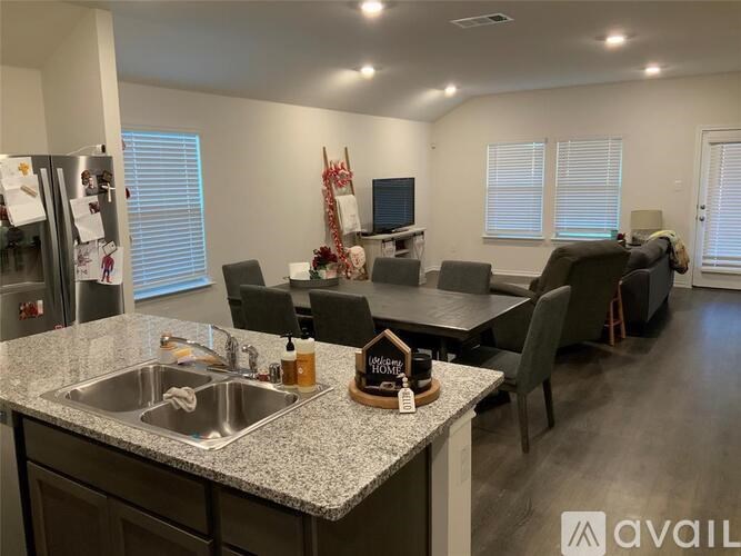 A kitchen with granite countertops and a sink.