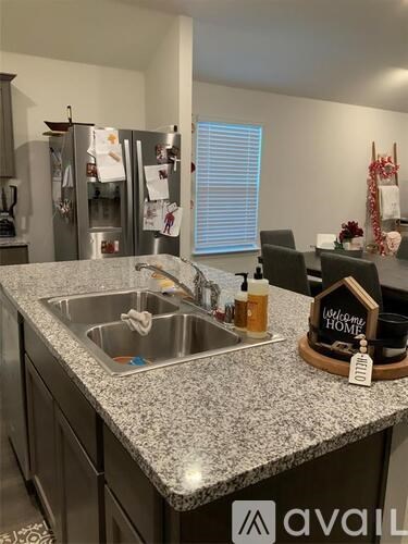 A kitchen with granite countertops and a sink.