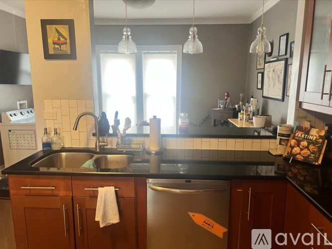 A kitchen with a sink and a dishwasher.