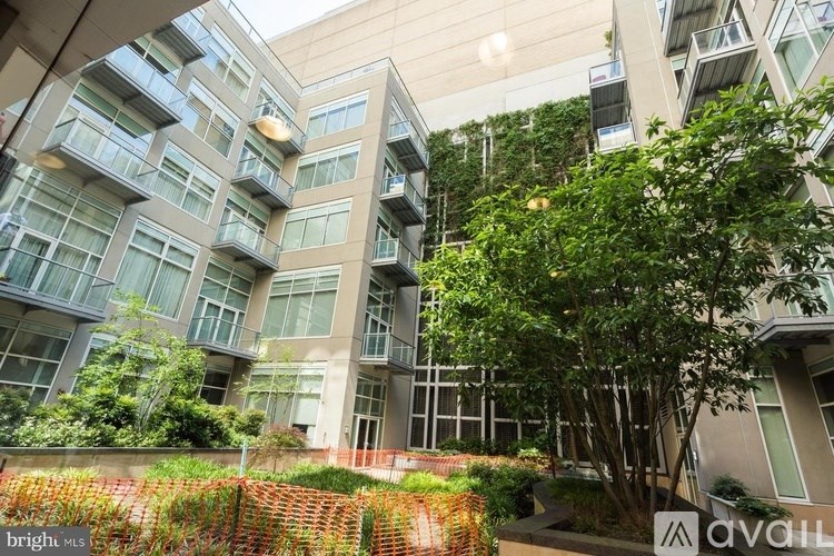 A modern building with a green tree in front.