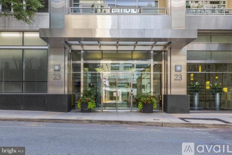 The image shows the front of a building with the number 23 on it.