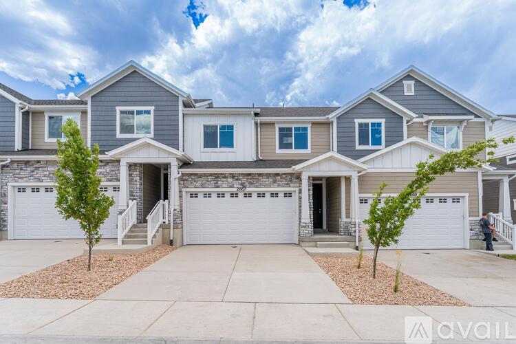 A row of houses with a sign that says "available" in front of them.