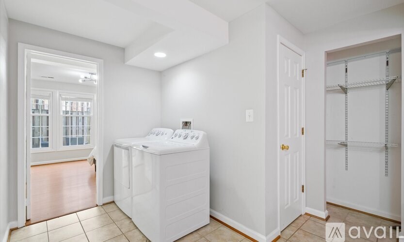 A white bathroom with a walk-in shower and a toilet.
