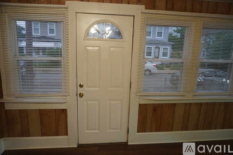 A white door with a window on either side.