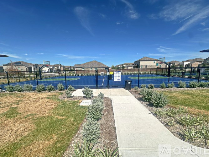 A sunny day at a park with a clear blue sky.