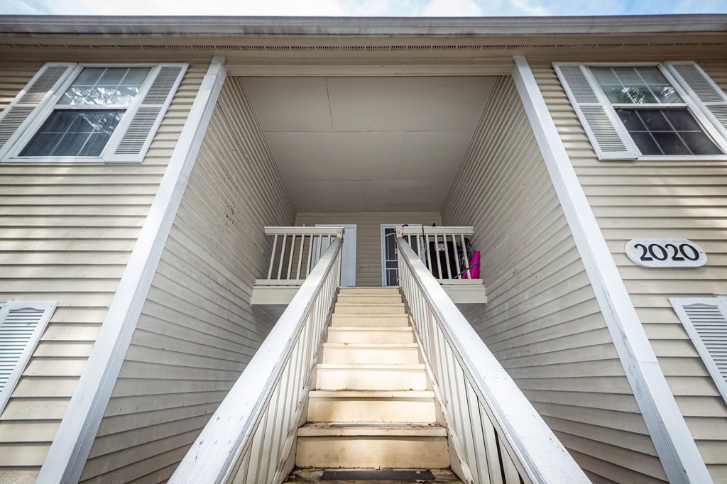 A staircase leads up to the second floor of a house.