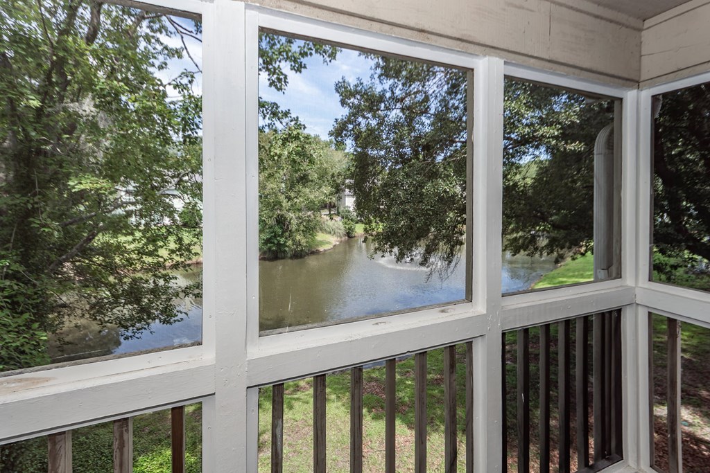 A view from a porch looking out to a river.