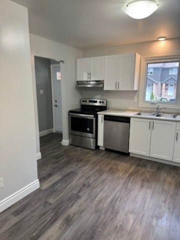 A kitchen with a stove top oven and a dishwasher.