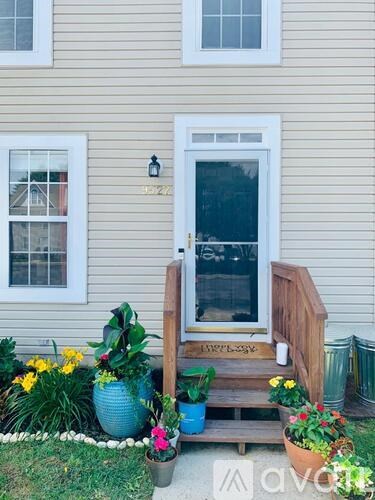 A house number 3222 with a white door and windows.