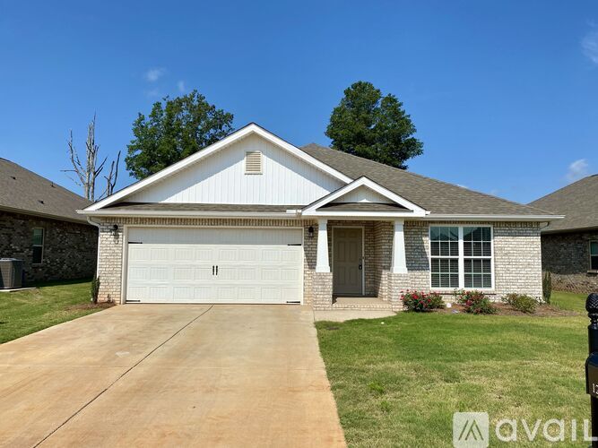 A house with a white garage door is for sale.