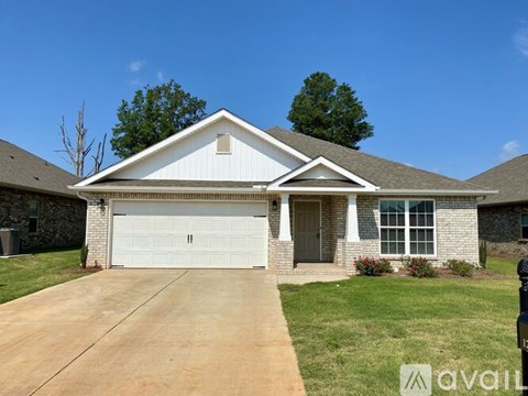 A house with a white garage door is for sale.