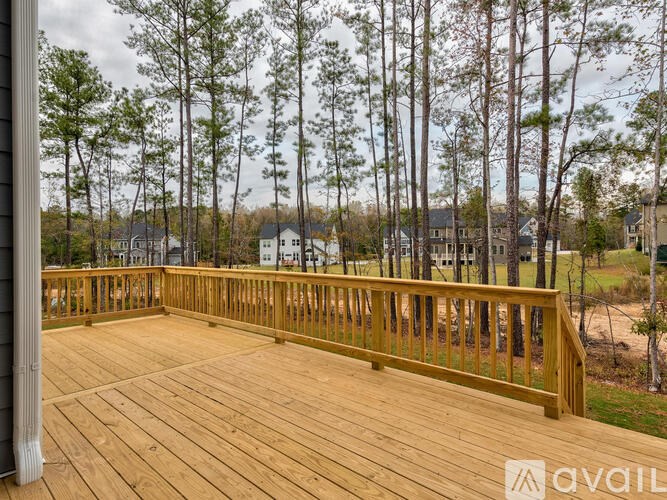 A wooden deck overlooks a residential area.