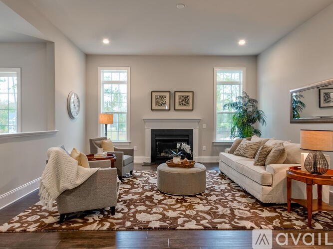 A living room with a fireplace and a couch.