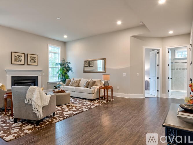 A living room with a fireplace and a couch.