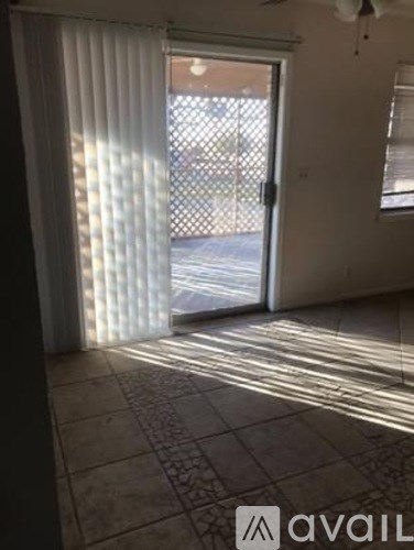 A room with a sliding door and a fan on the ceiling.