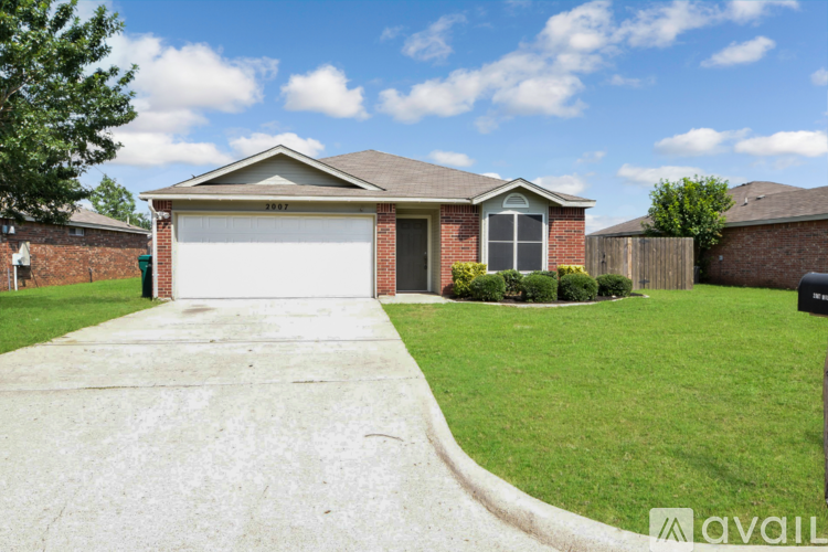 A house with a garage and a driveway.