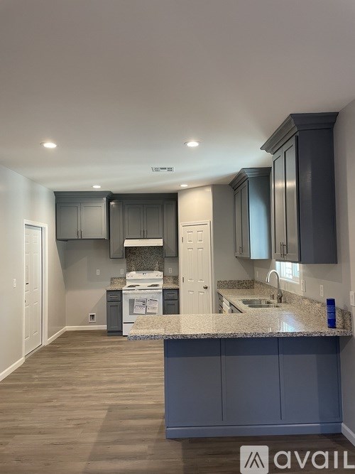 A kitchen with a countertop and cabinets.