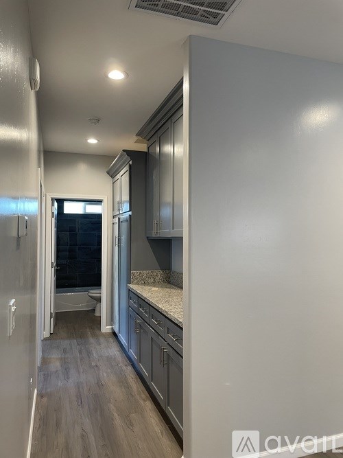 A kitchen with a countertop and cabinets.
