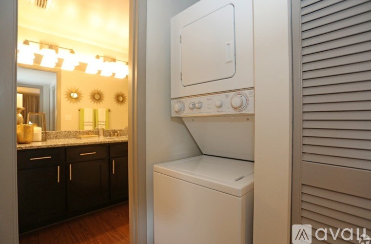 A white washing machine in a kitchen.